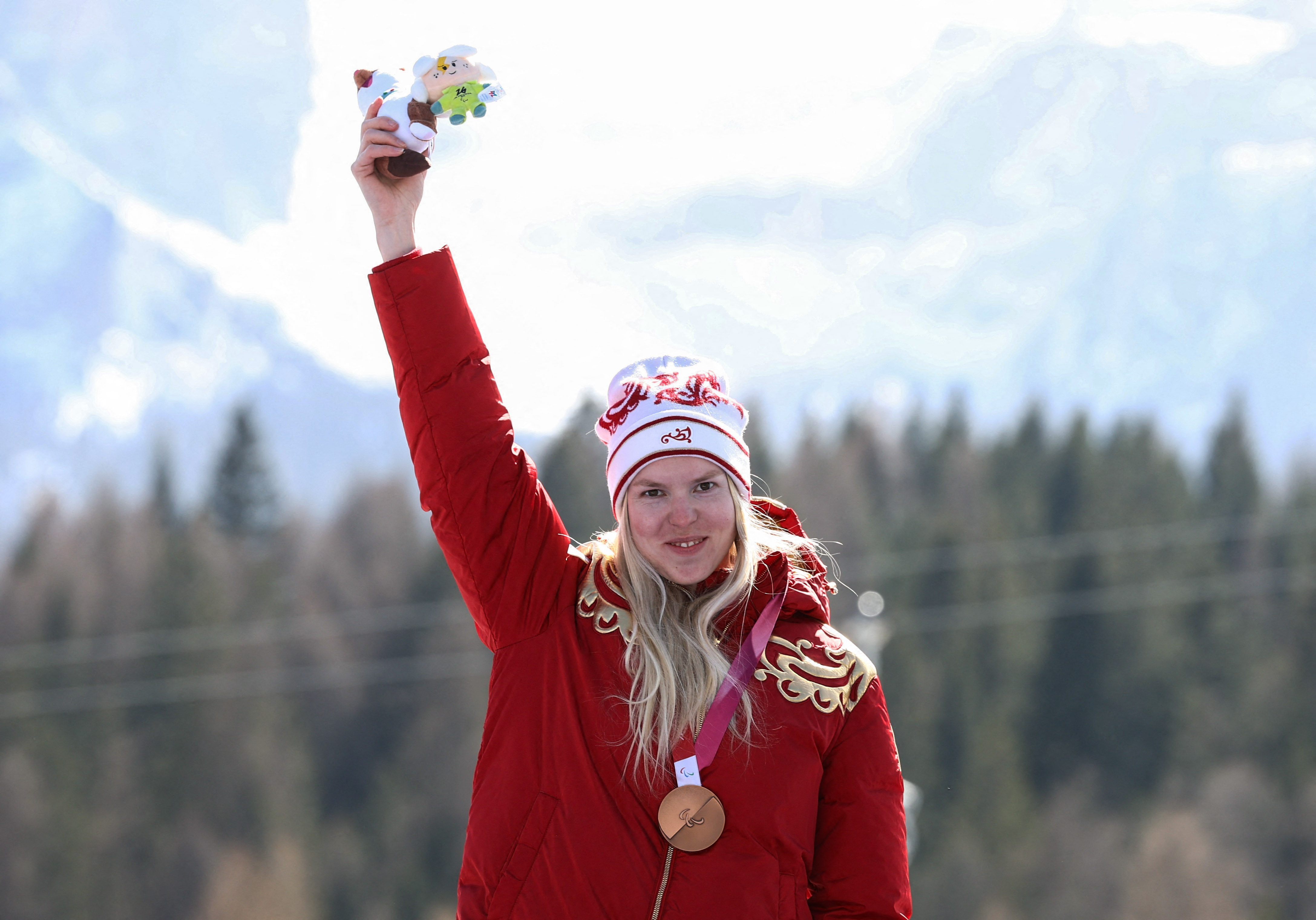 cover Russian flag returns to Games podium with two downhill bronzes