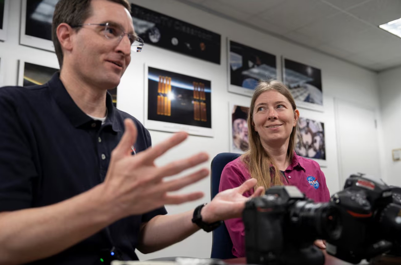 Paul Reichart and Kristina Willoughby, the photography trainers who trained the NASA Artemis II crew to take photos of the moon, speak with Reuters at the NASA Lyndon B. Johnson Space Centre in Houston, Texas, U.S., April 14, 2026. REUTERS/Danielle Villasana

