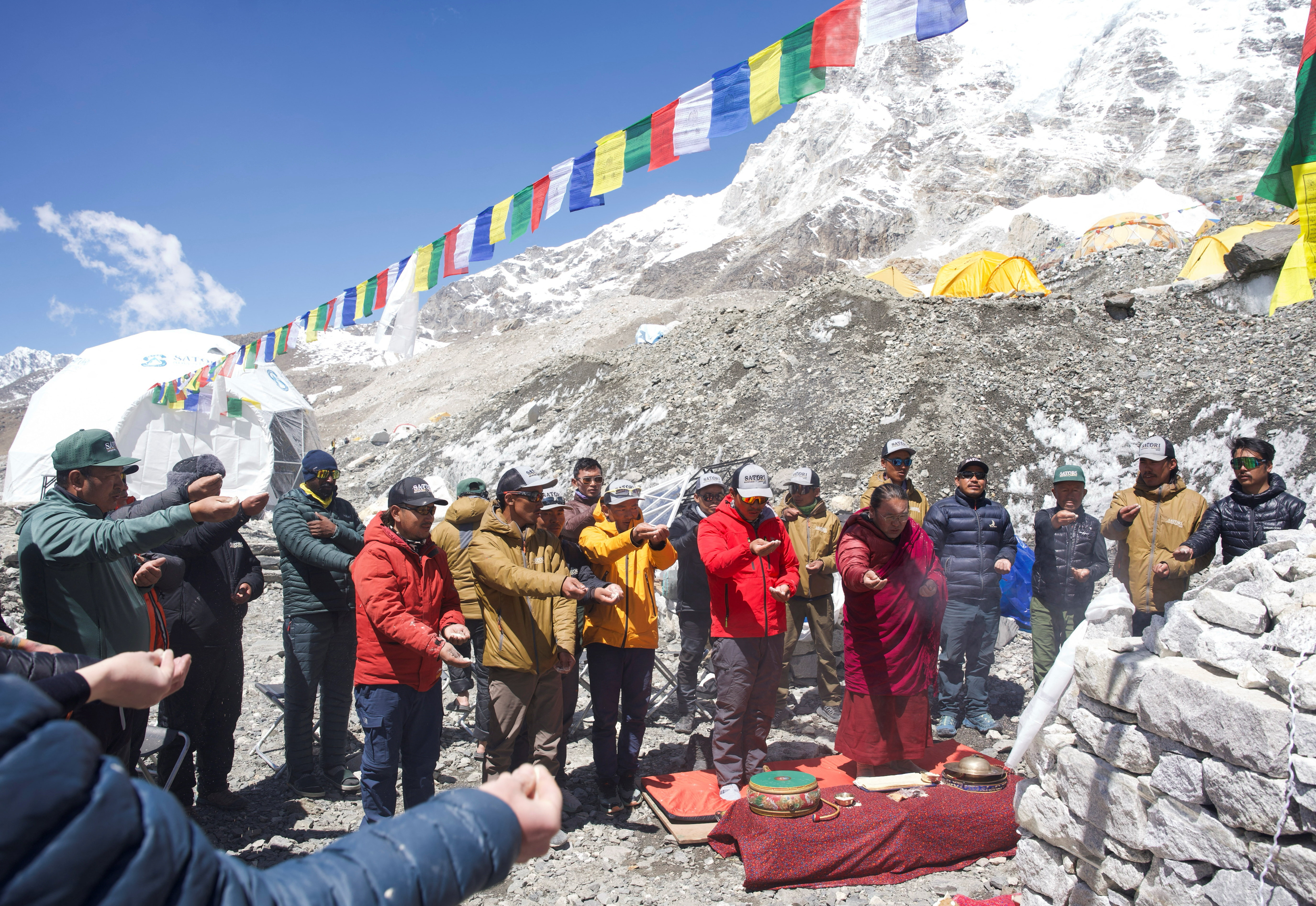 cover Sherpas cross icefall, open route for climbers to move up on Everest