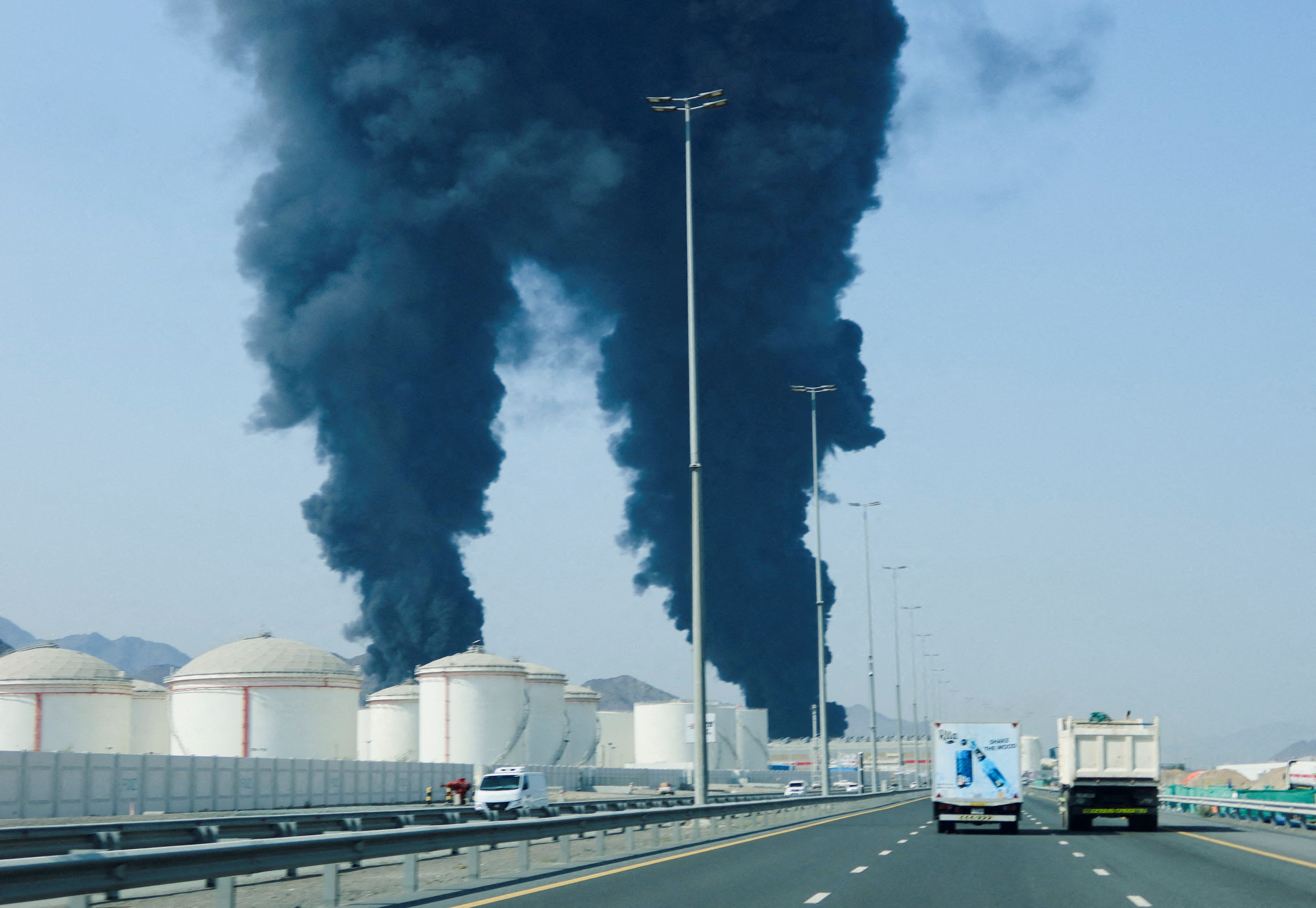 cover Fujairah oil zone hit by fire after drone attack as UAE says it intercepted Iran missiles