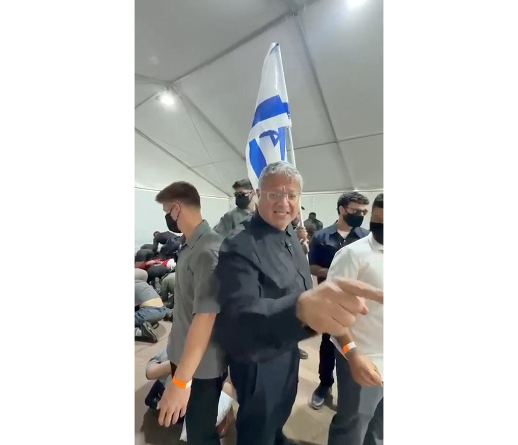 cover Condemnation after Israeli police force Gaza flotilla activists to kneel with hands bound