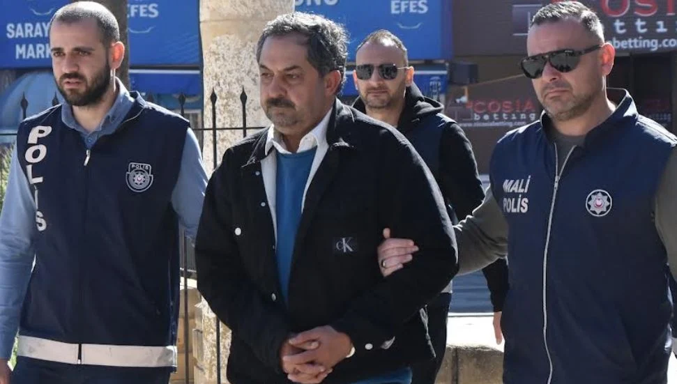 Mehmet Hasguler being taken to court after being arrested