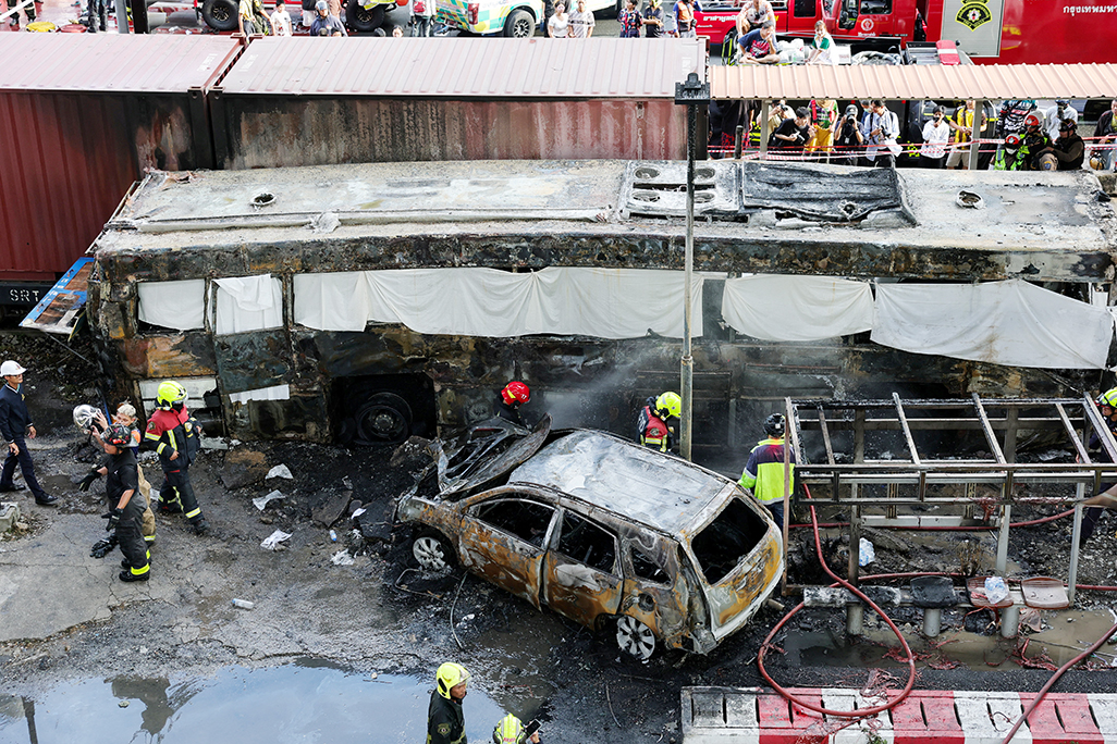 cover At least eight dead, 25 injured in train collision that sparks bus fire in Thailand
