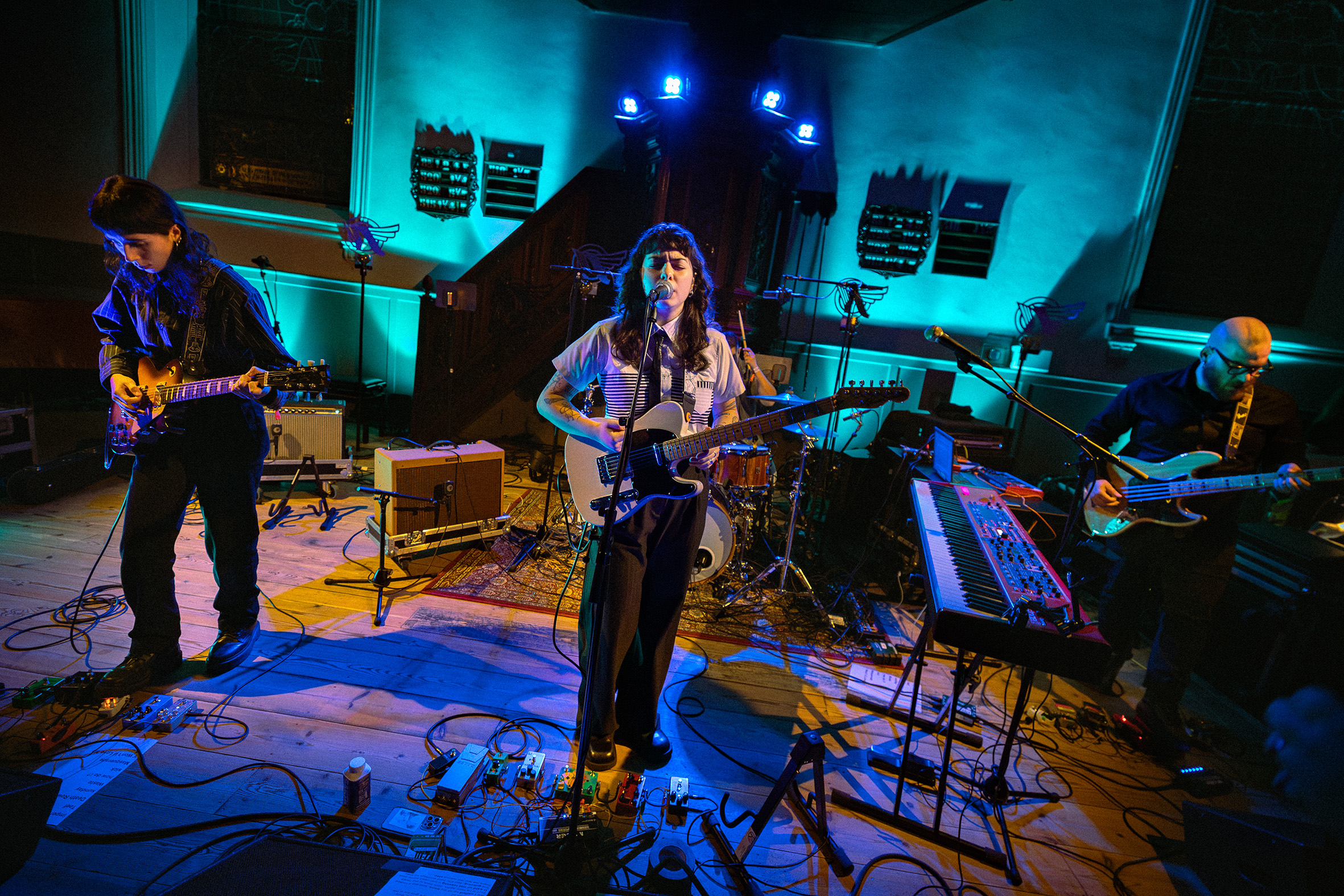 image Della and an orchestra live at a church