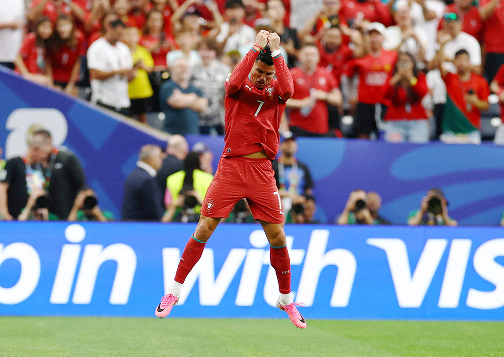 cover Record-breaker Ronaldo guides Portugal to 5-0 win over Uzbekistan