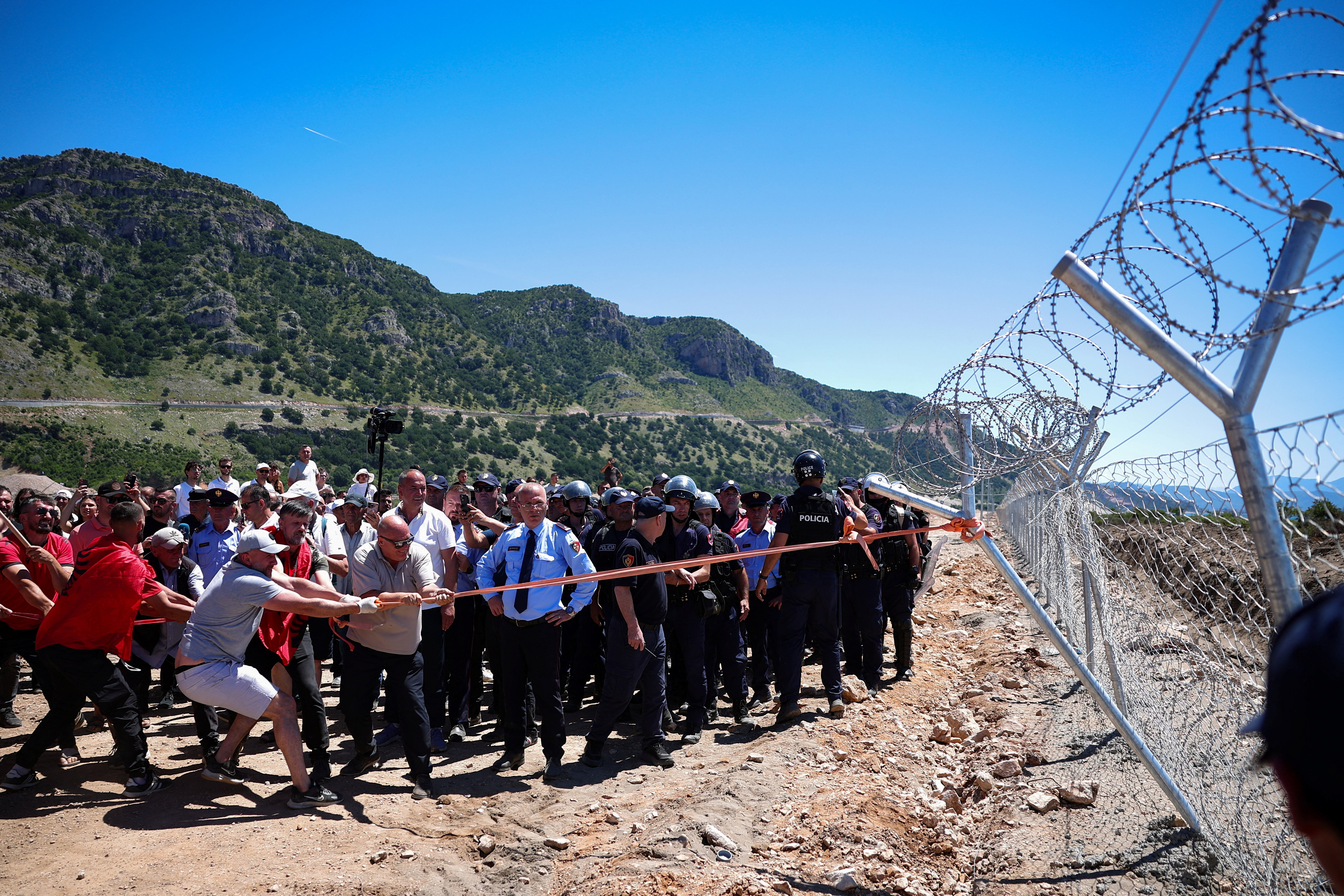image Protesters tear down Albanian development site fences, amid anger over coastal projects