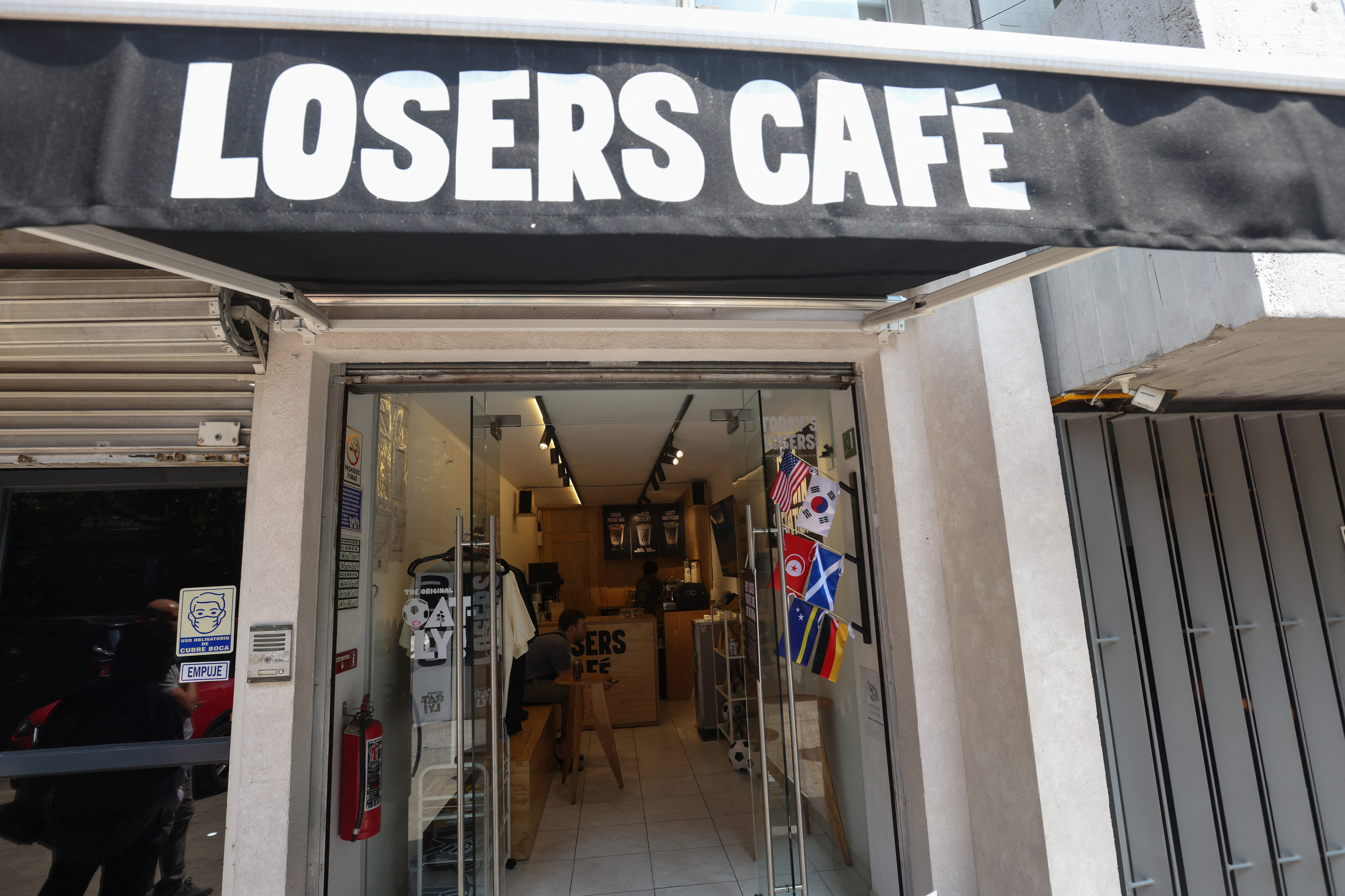 cover Eliminated but not alone: Mexico City cafe becomes haven for World Cup heartbreak