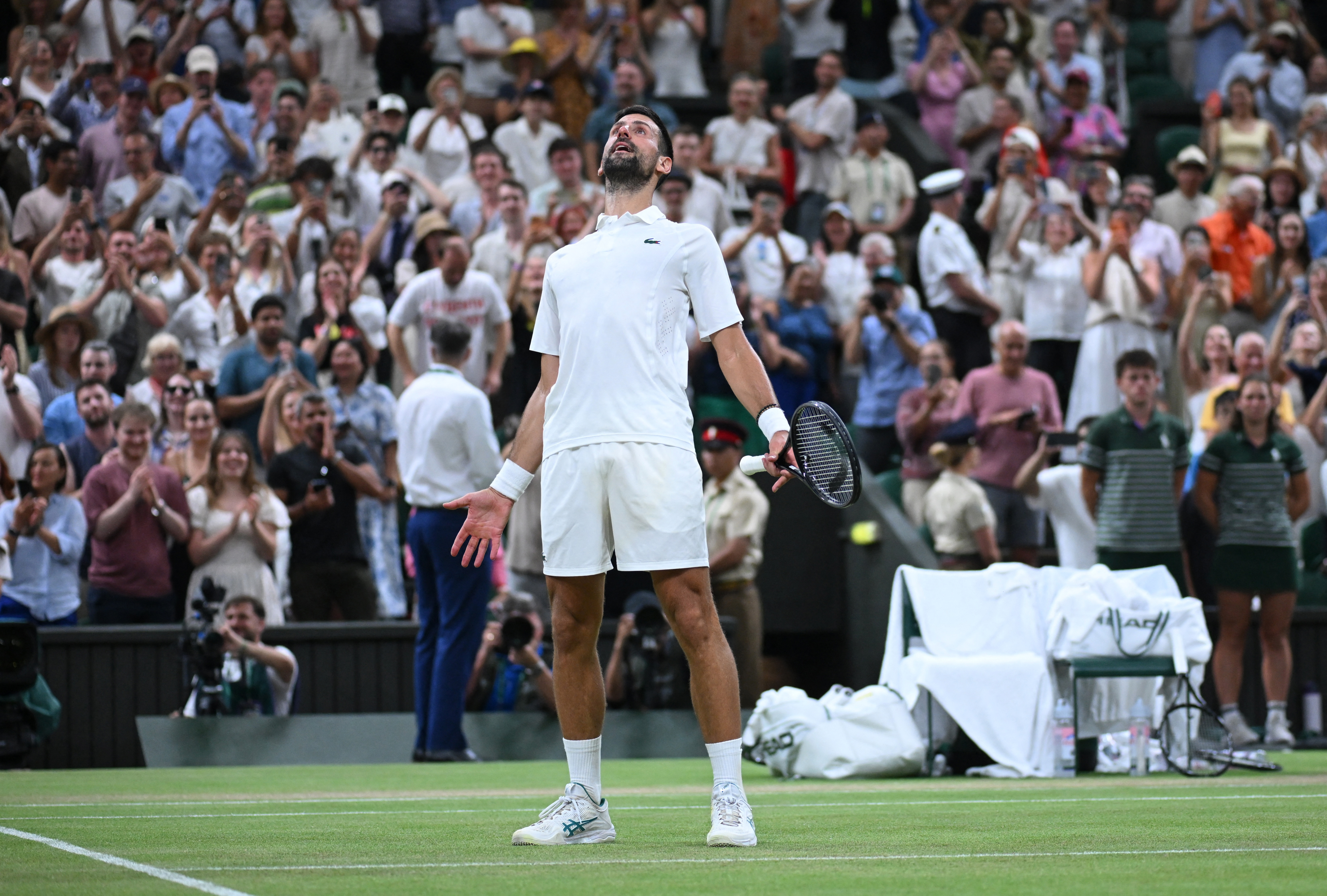 cover &#8216;Racket and heart&#8217; as Djokovic tames Auger-Aliassime to return to Wimbledon semis