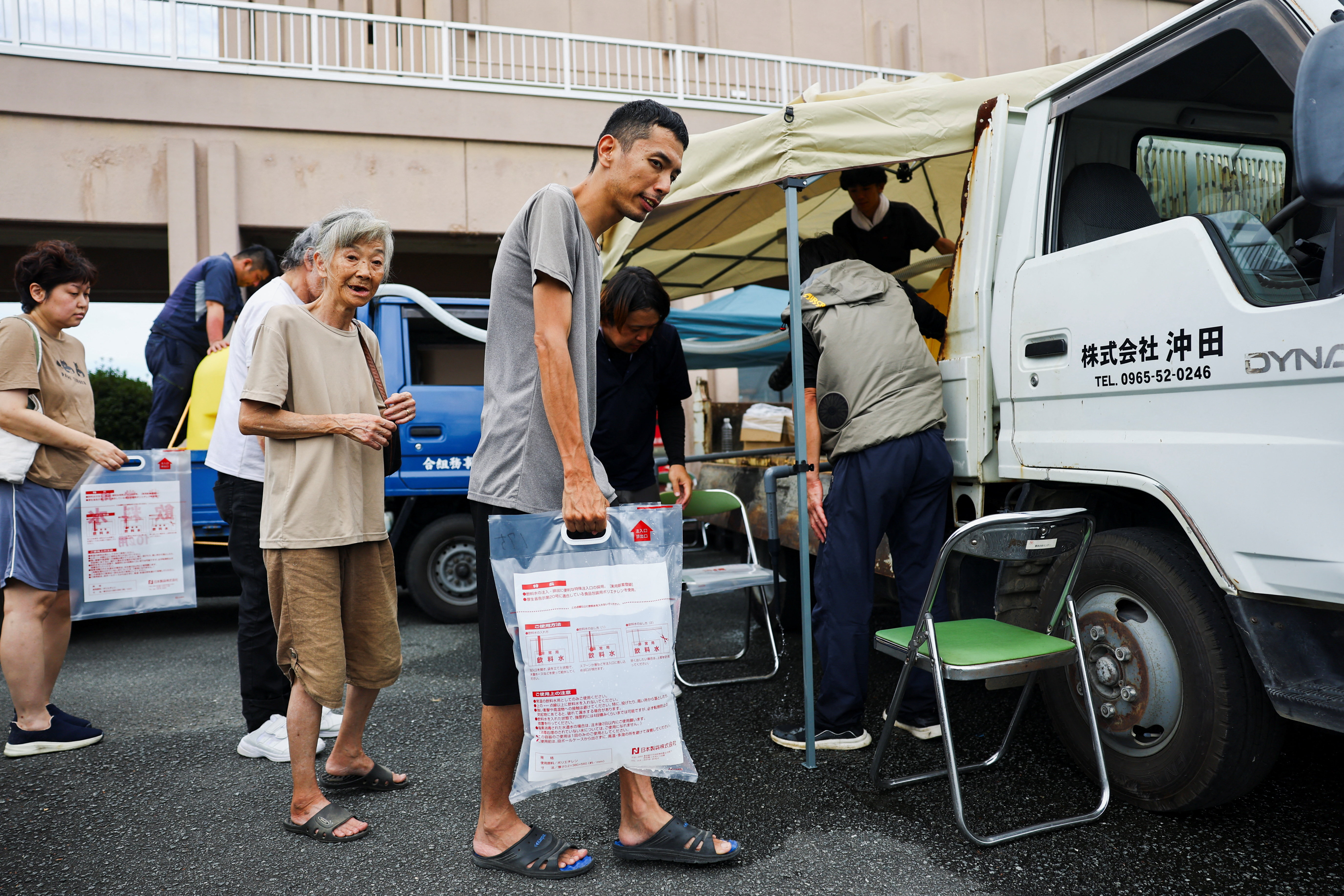 cover Japan quake survivors battle thirst, heat as toll rises to 17