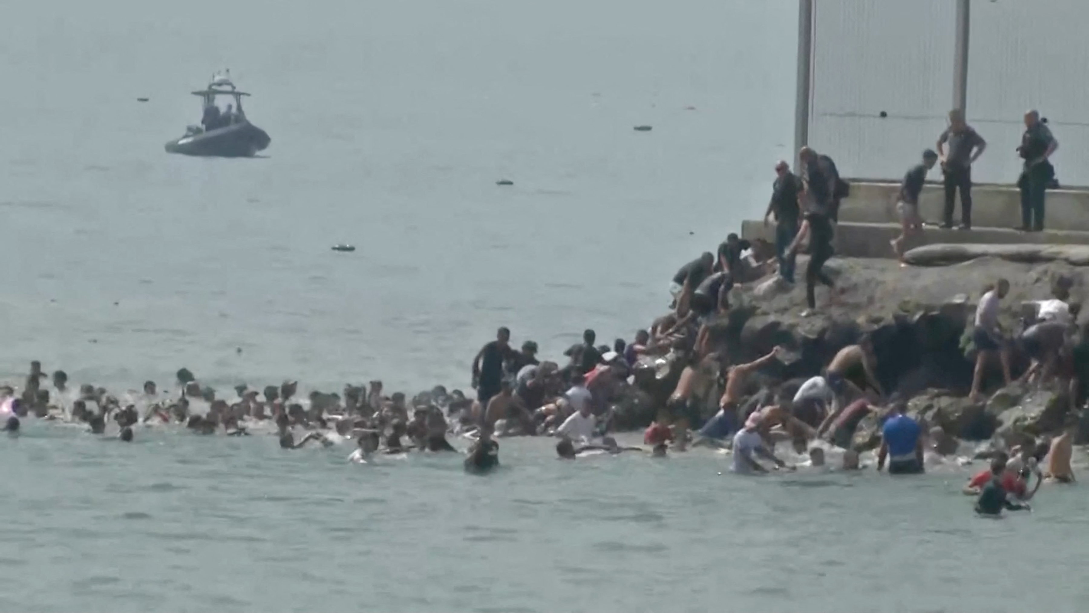 image Migrants break through border into Spain&#8217;s Ceuta, military called in