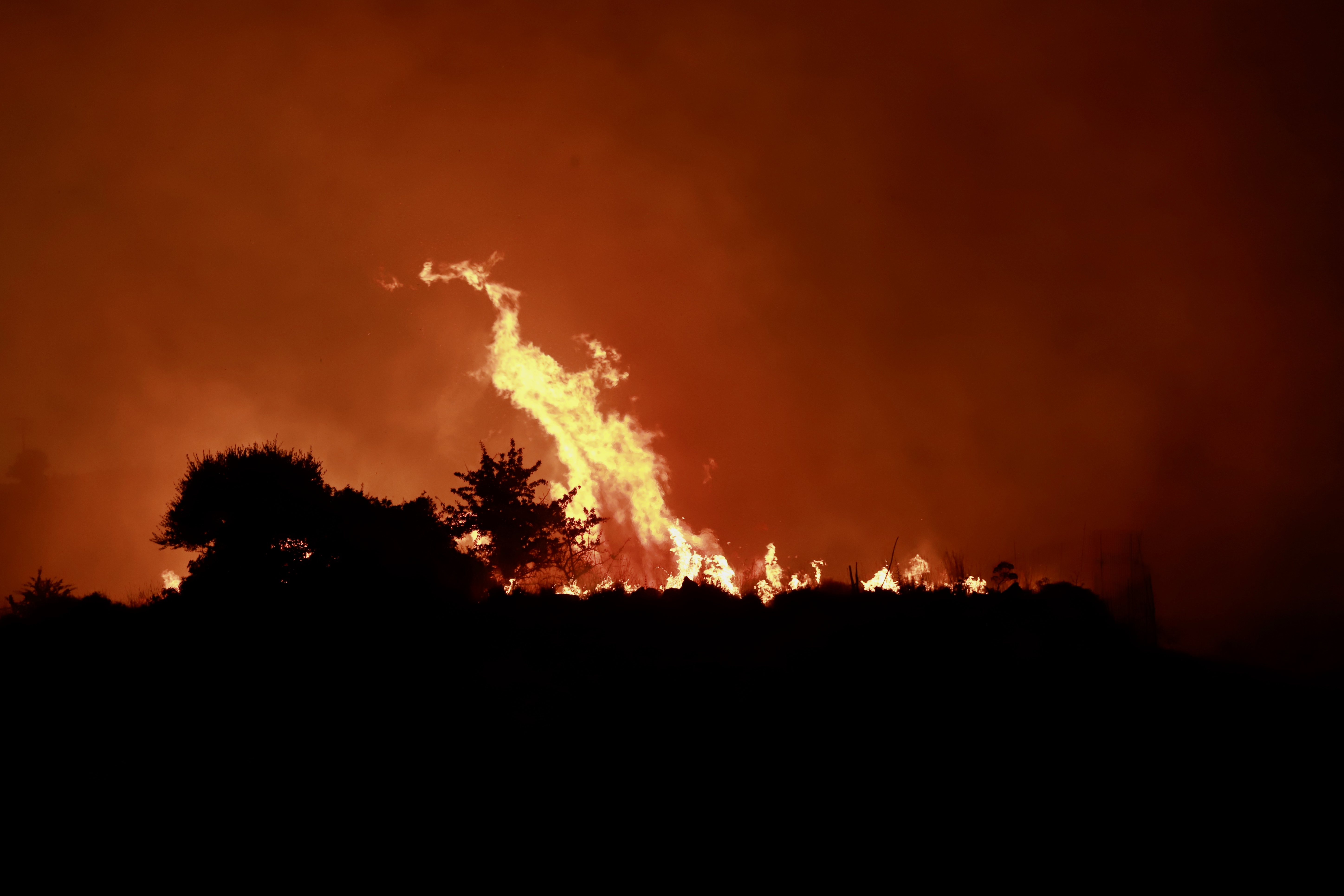 cover Longinos offers condolences after three Greek firefighters die battling wildfires