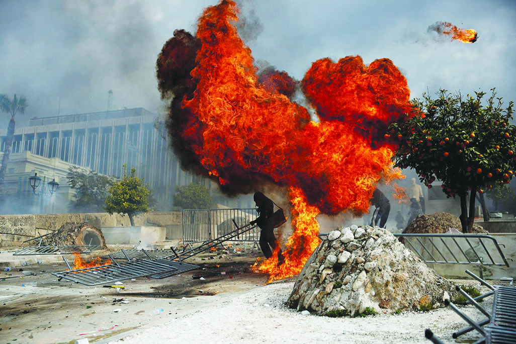 cover Greek ruling party calls for protests after firebomb kills candidate&#8217;s mother