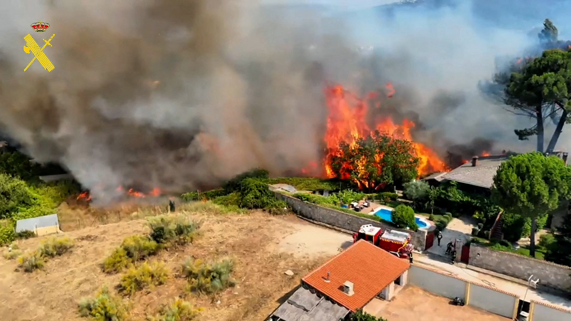 cover Tens of thousands flee fires in France, blazes merge outside Madrid