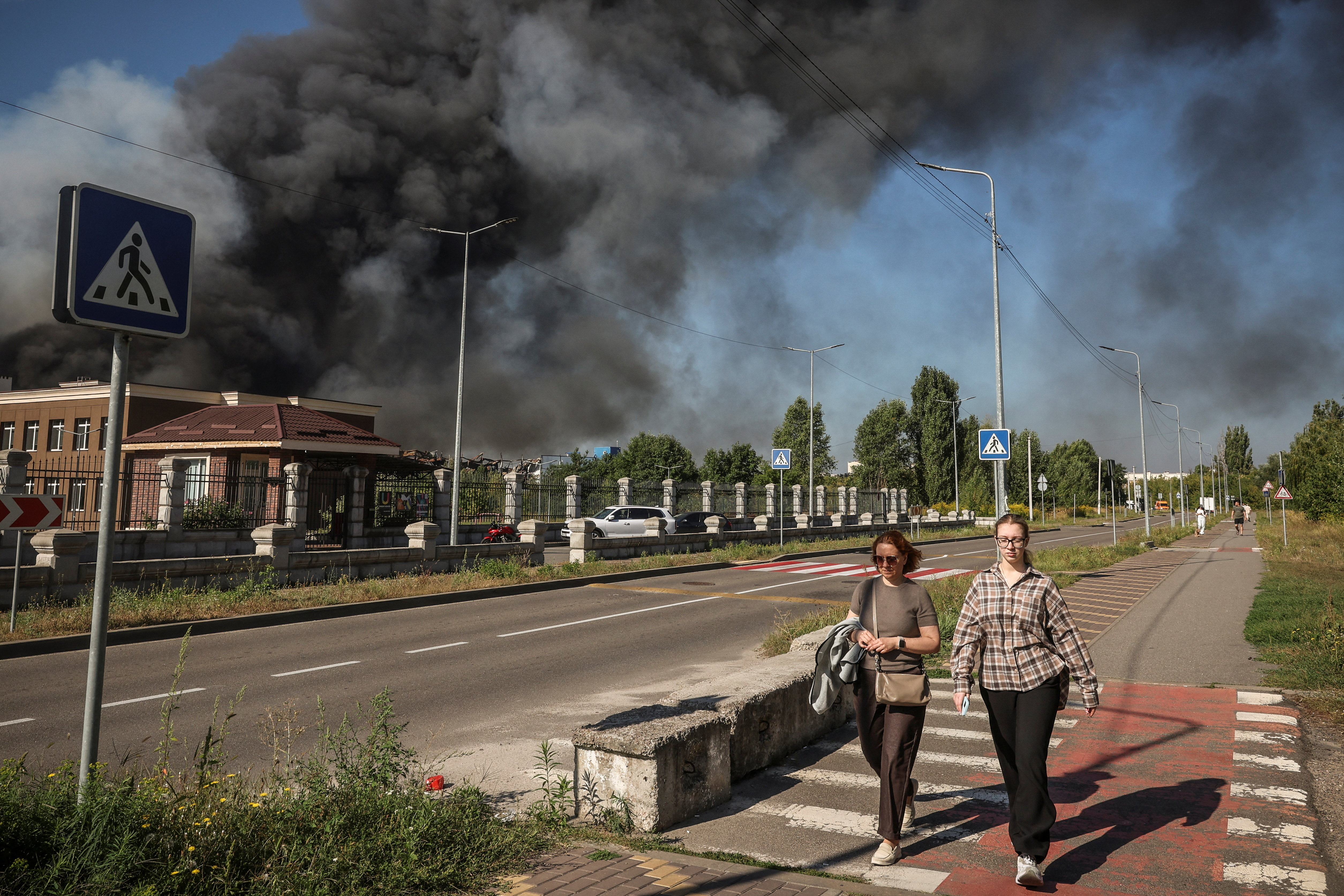 cover Russian strike on Kyiv-area warehouse causes detonation, killing 27