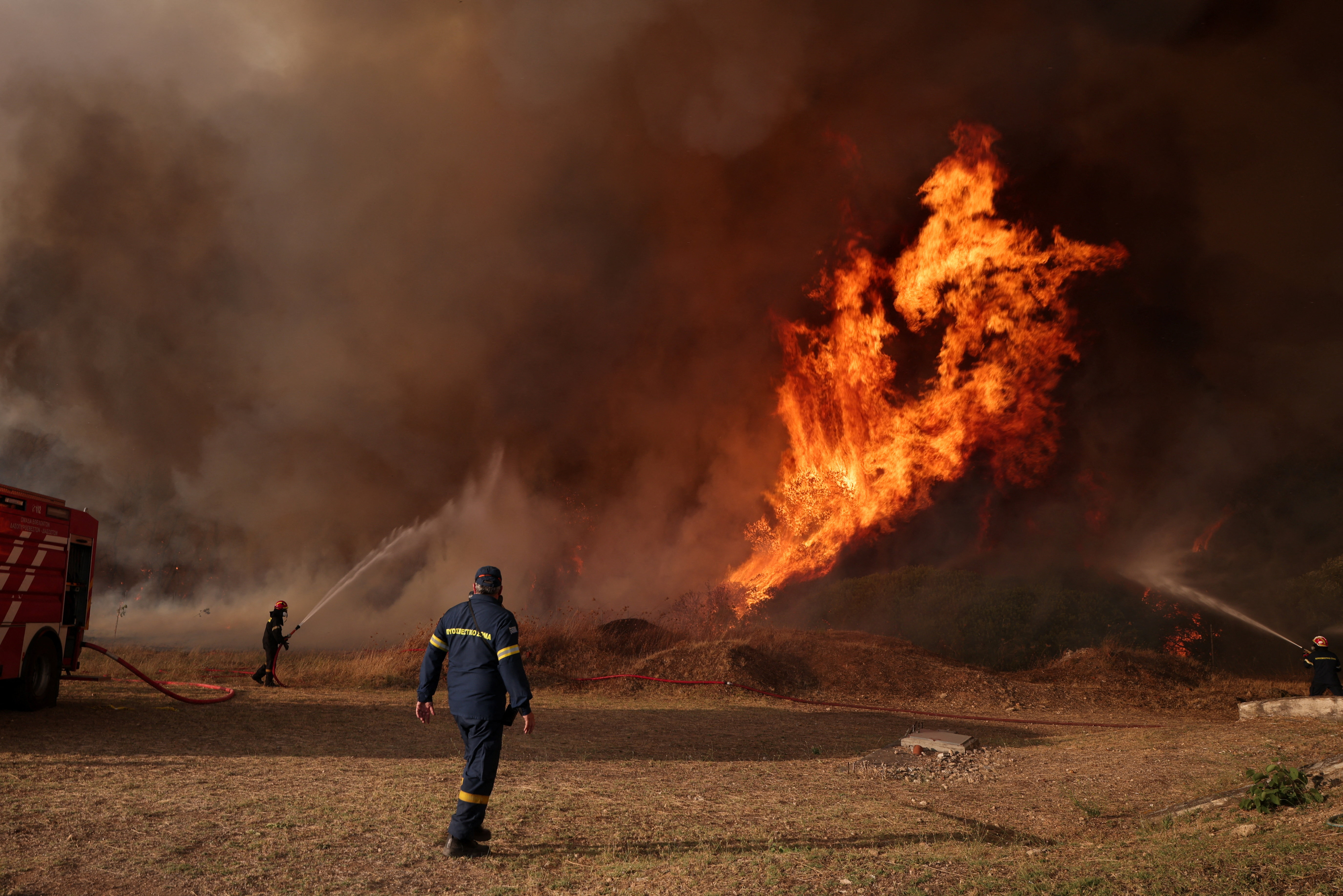 image Firefighters battle through the night as Greek wildfire scorches more than 130 square kilometres
