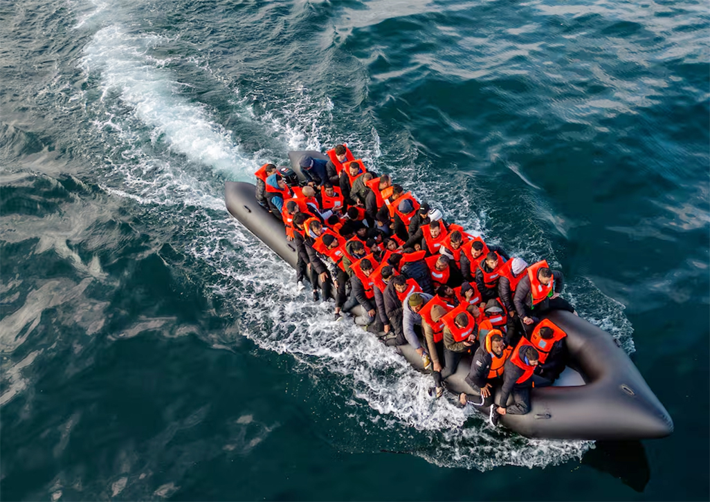 cover French coastguards rescue 157 from burning migrant boat in English Channel