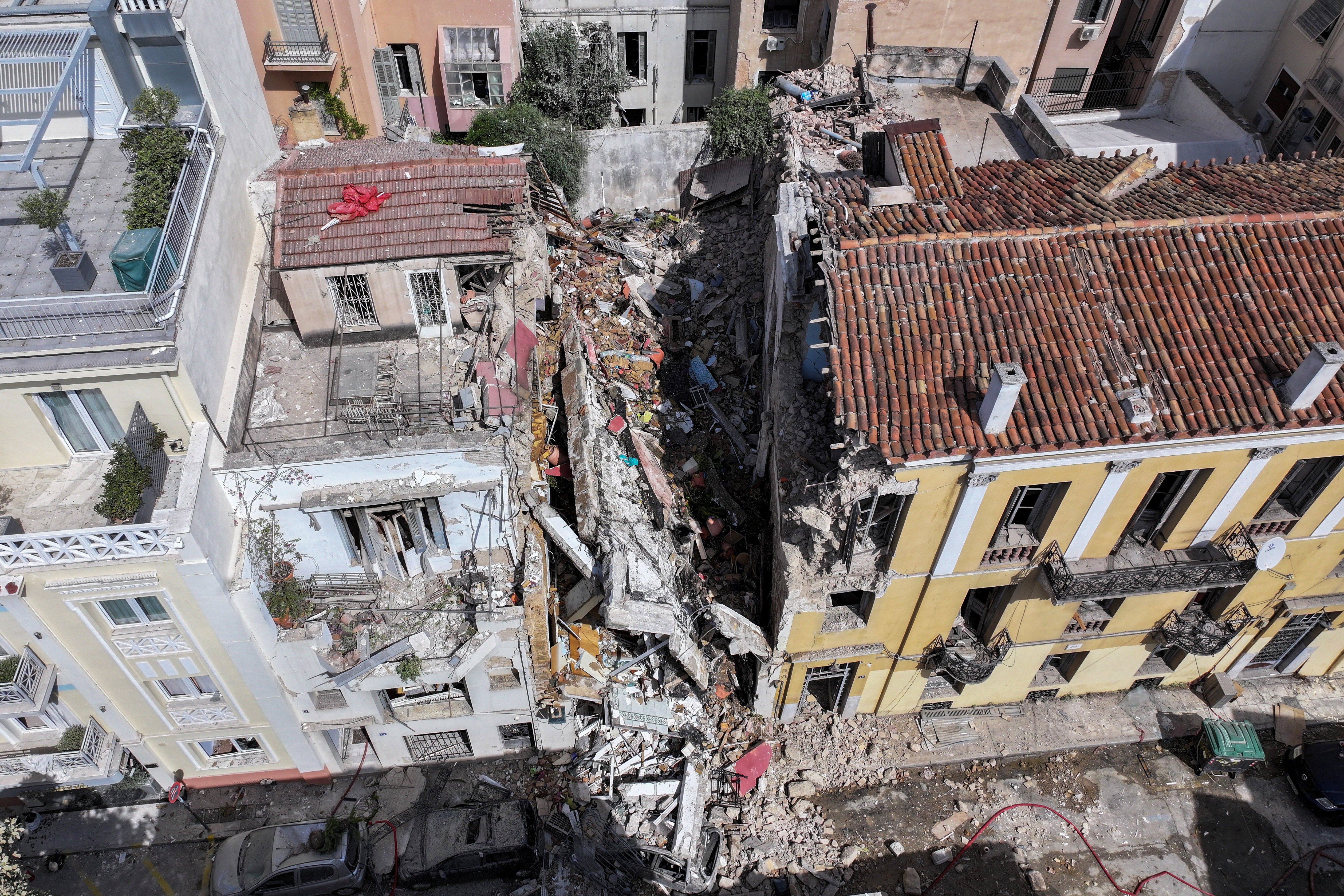 cover One dead, five missing after explosion destroys building in Athens