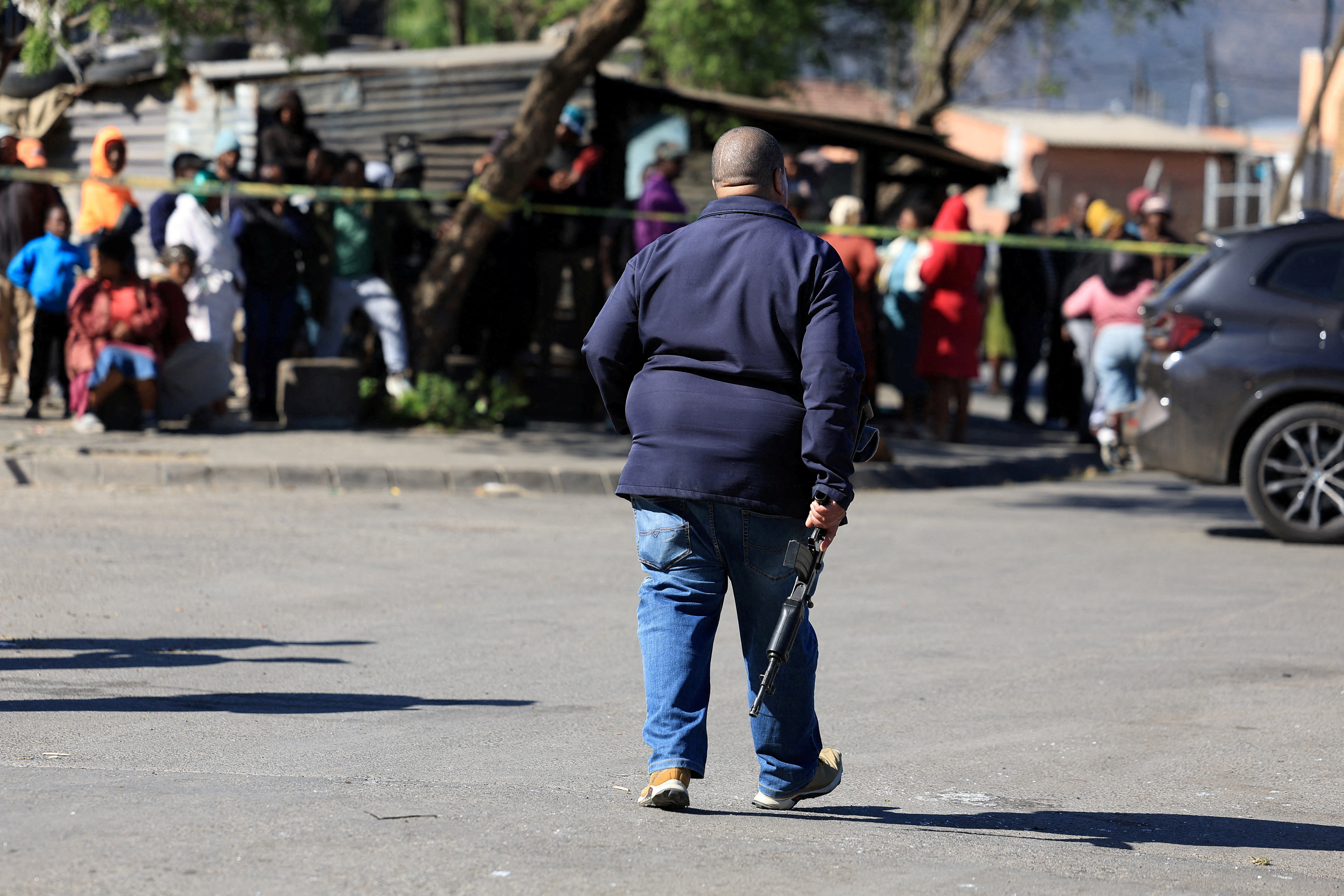 cover South Africa police launch manhunt after 17 killed in tavern shooting