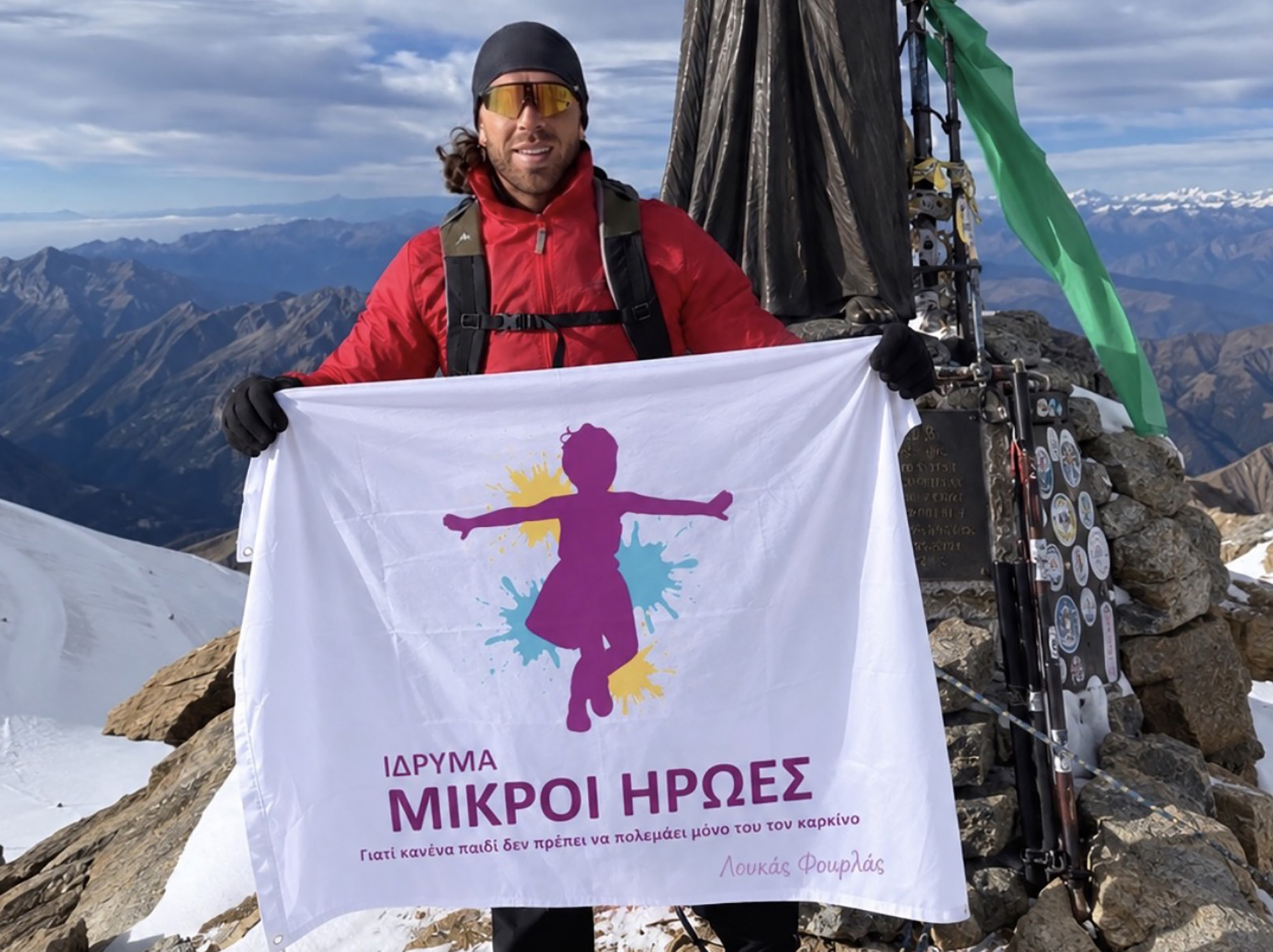 image Cyprus climbers raise cancer charity flag in Italian Alps