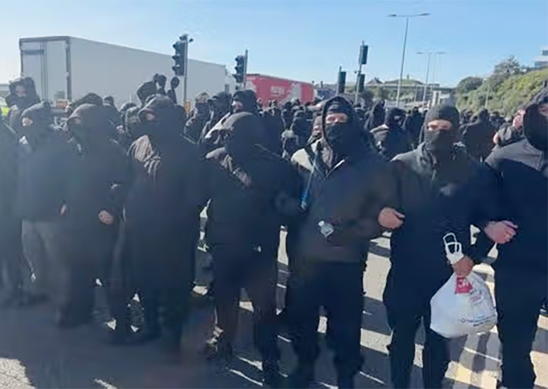 cover Masked men protesting in Dover disrupt cross-Channel traffic