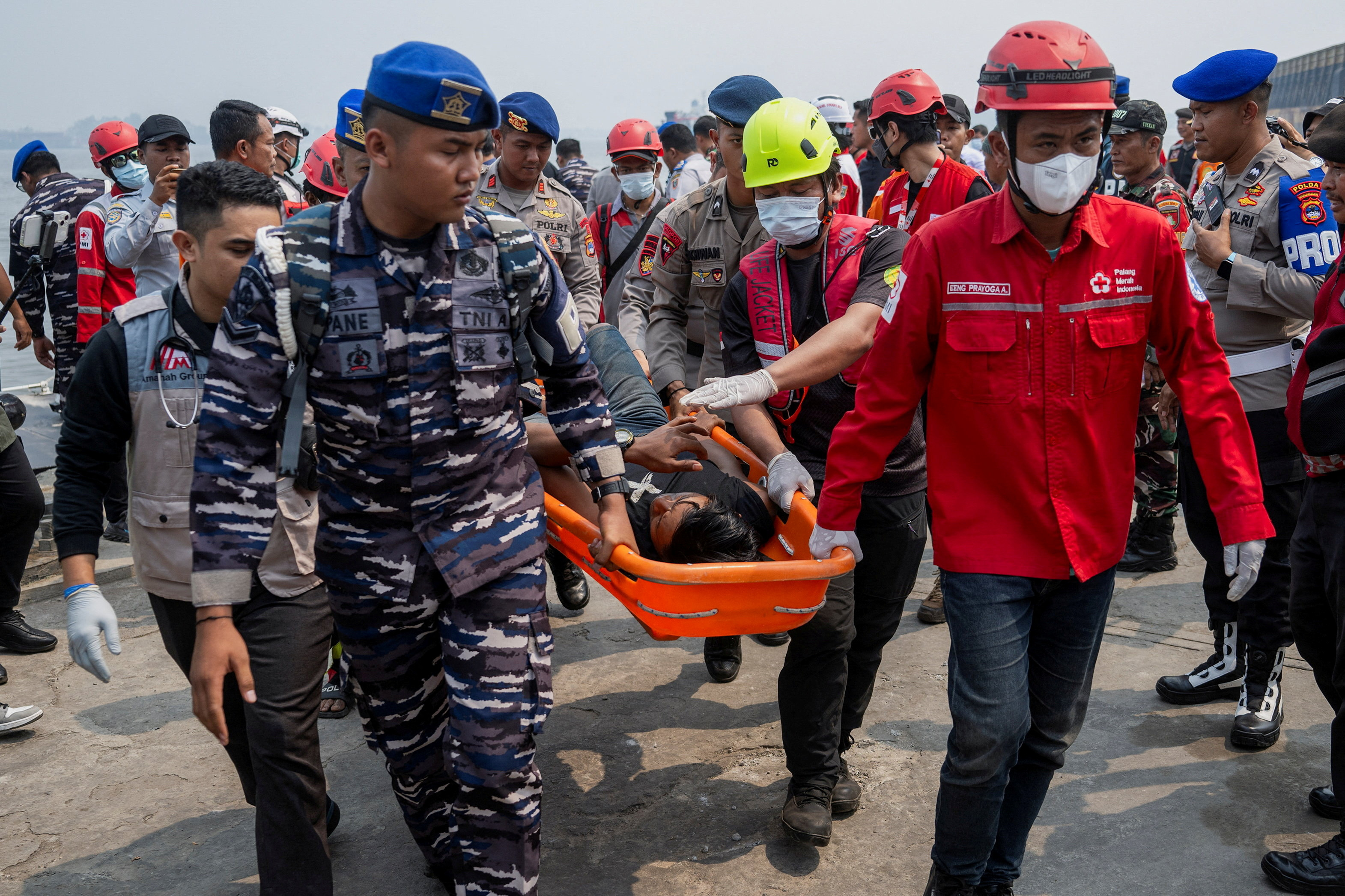 cover Indonesia recovers three bodies as effort begins to right capsized ship