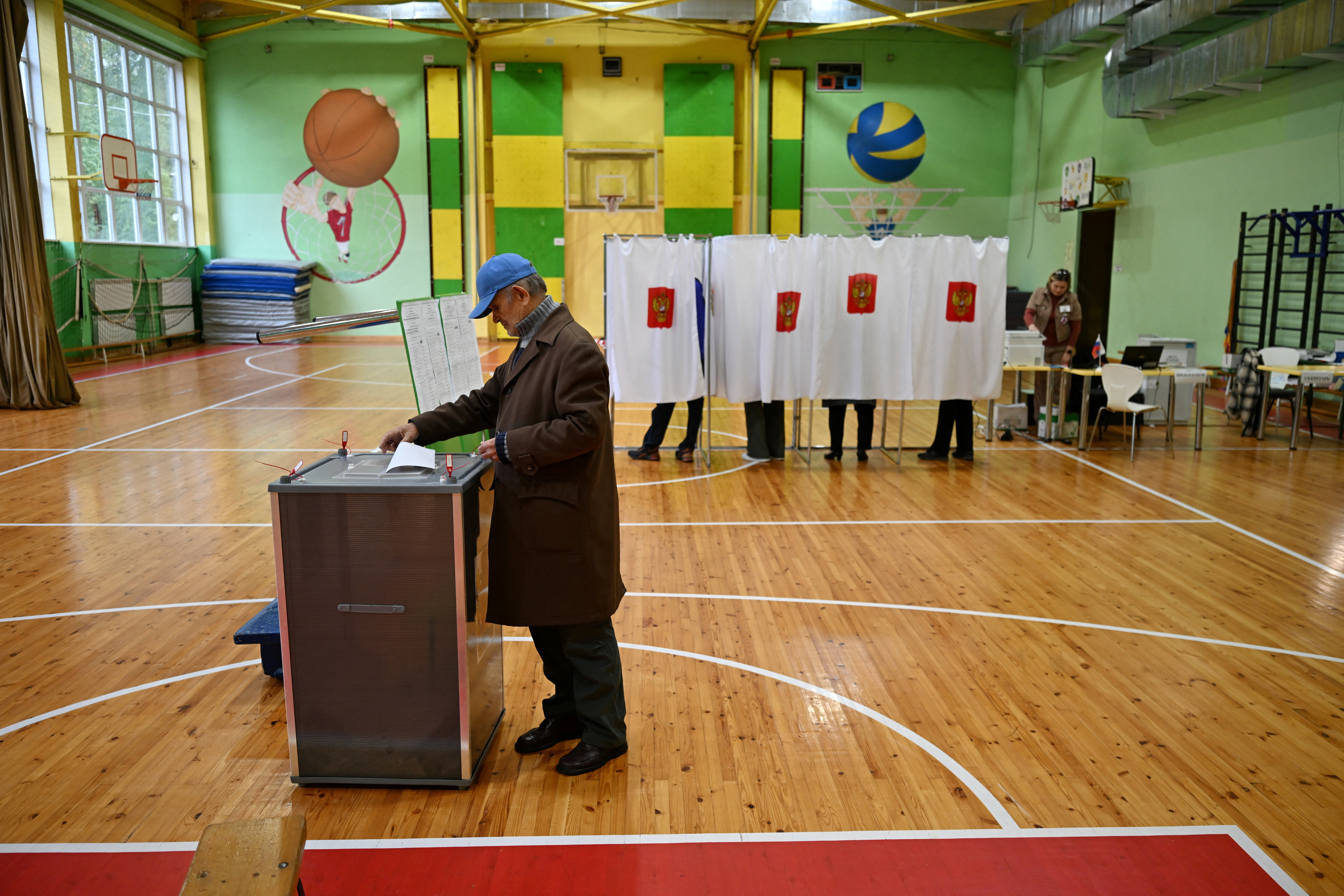 cover Russians vote in election that Putin sees as barometer of public support for his war in Ukraine