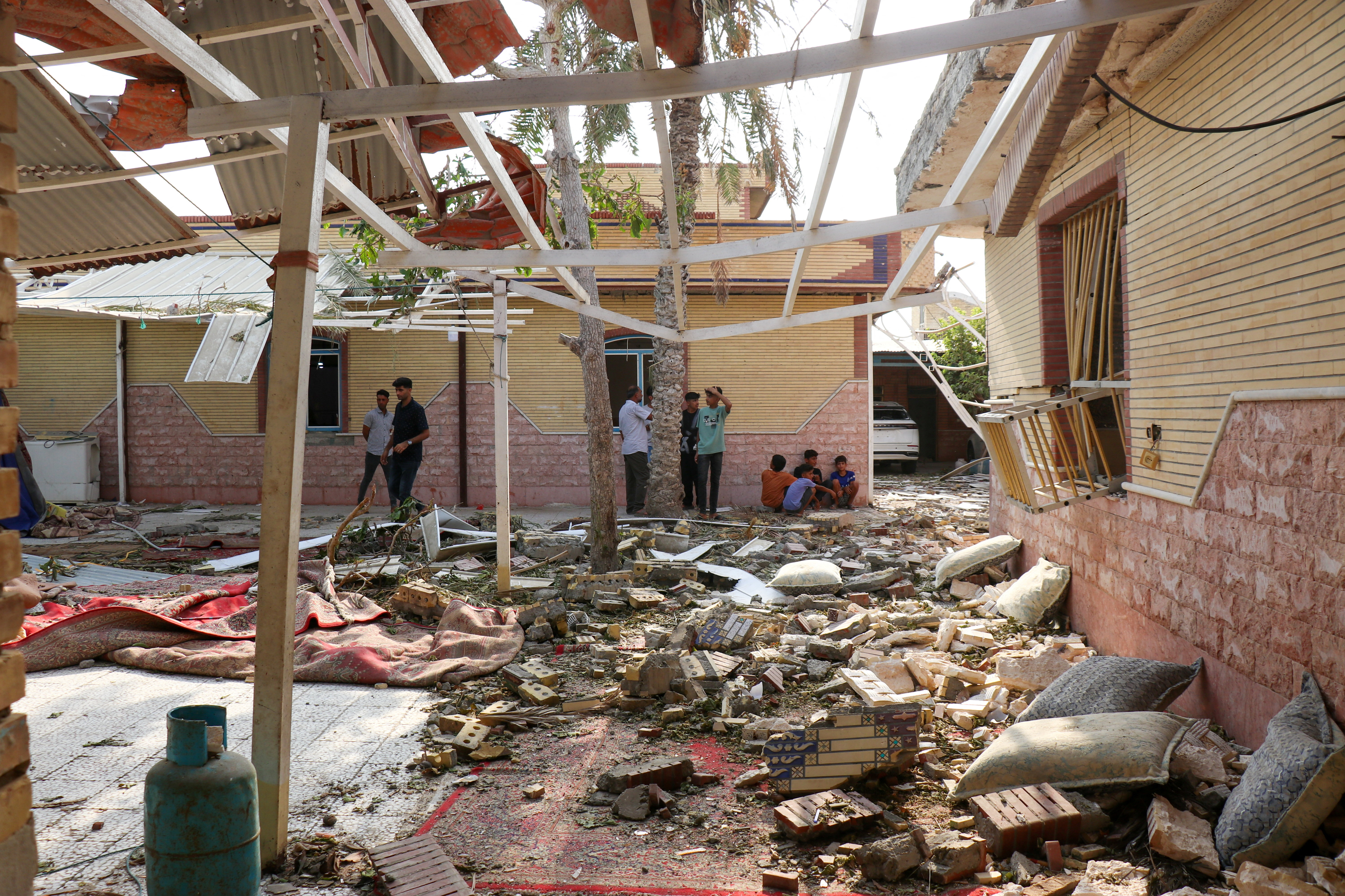 cover Iran reports 18 dead after US strikes, including four at wedding