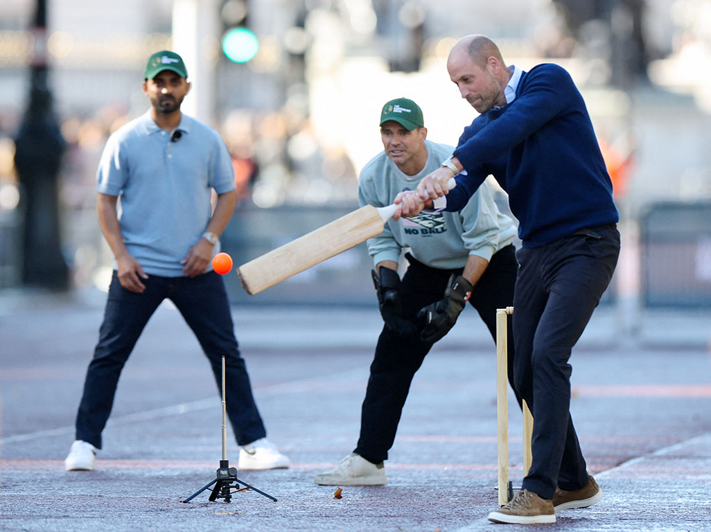 image Prince William stops traffic outside Buckingham Palace for a game of cricket