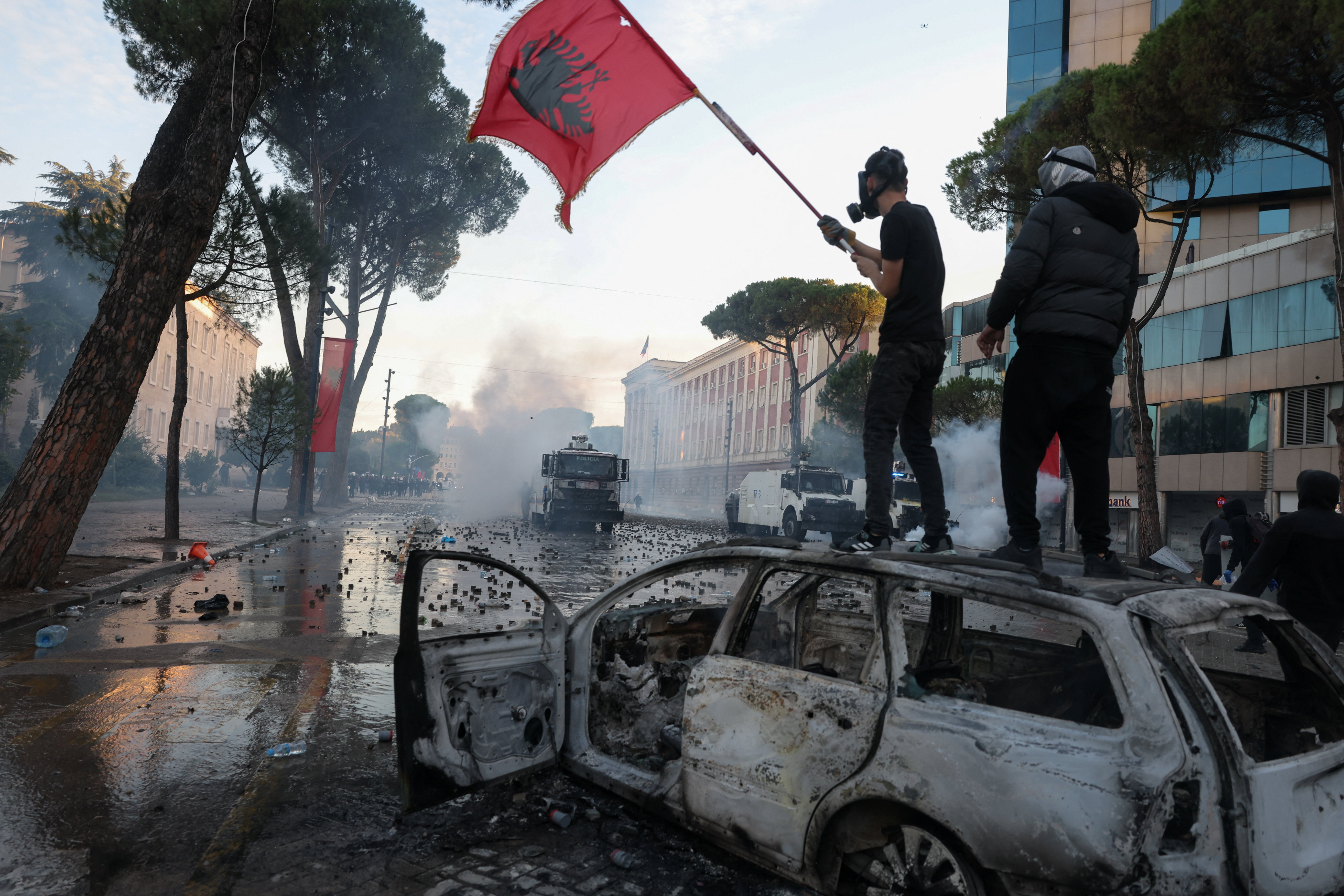 cover Albanian police fire rubber bullets as student protests rage