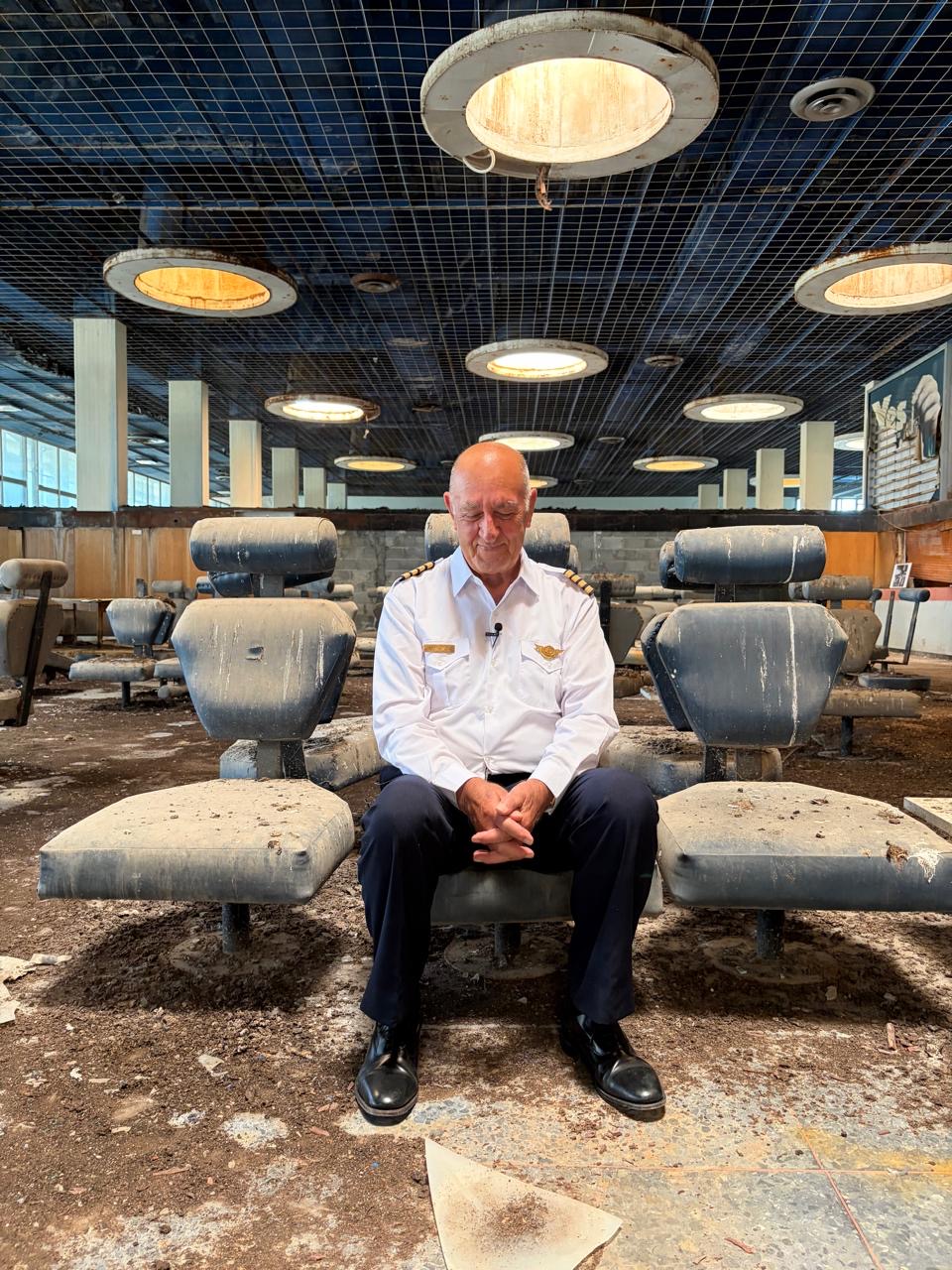 A recent photo Merneros at Nicosia Airport sat in the middle of the airport lounge waiting to board his flight which will never take off again