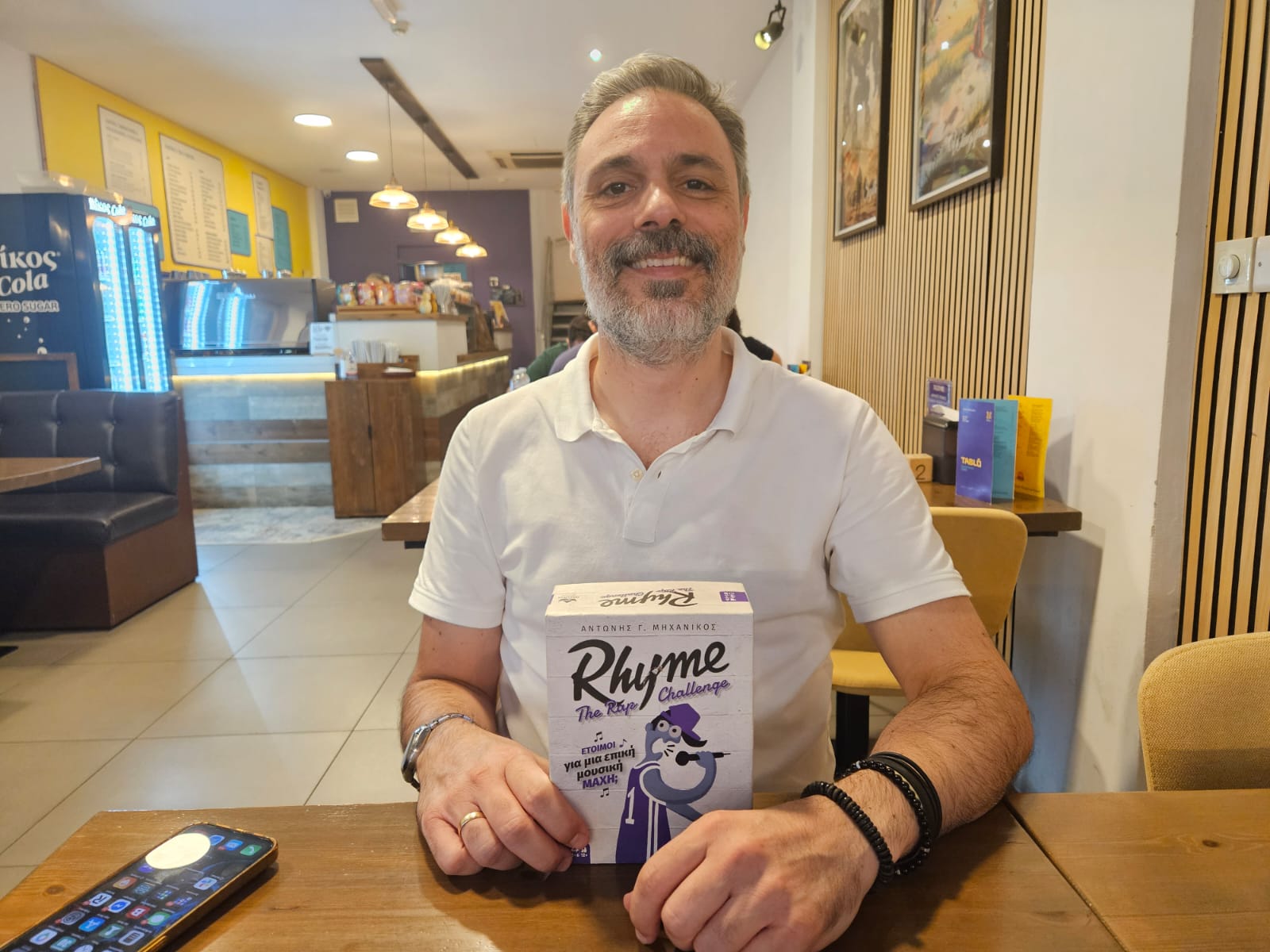 Andonis with the game he designed