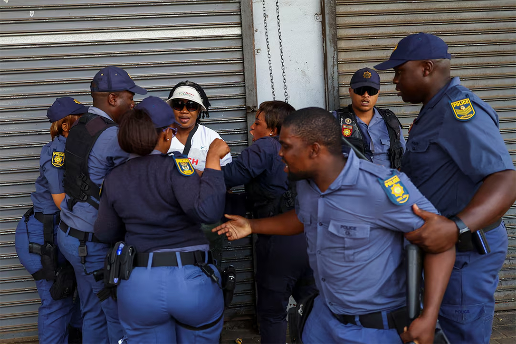 cover South African police investigate killing of foreign national by crowd
